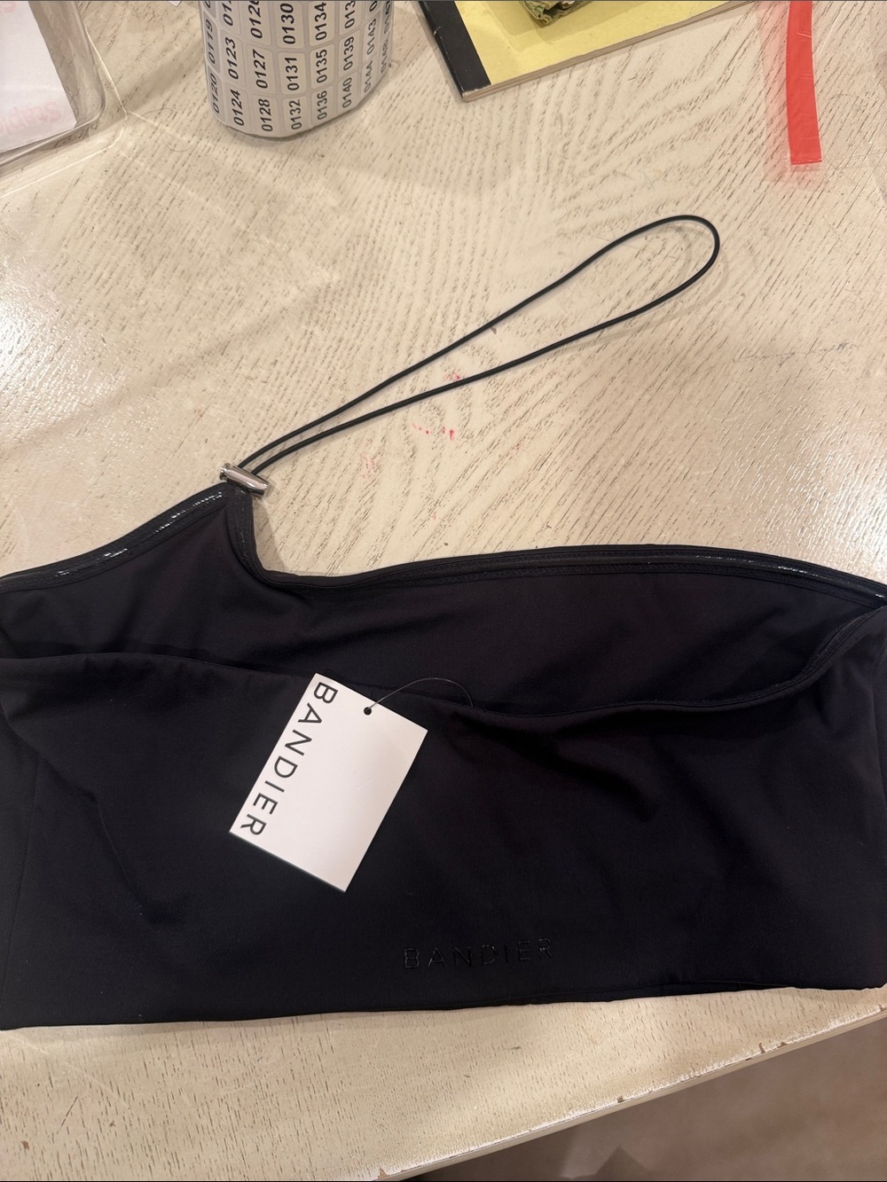 Bandier Black One-Shoulder Crop Top with Embossed Logo